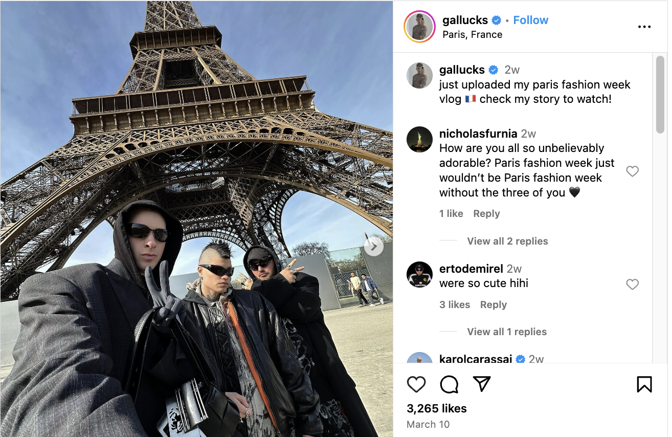 An Instagram post from Joel Mcloughlin and friends posing under the Eiffel Tower during Paris Fashion Week. 